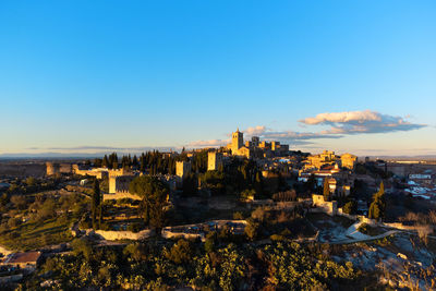 High angle view of townscape against clear blue sky