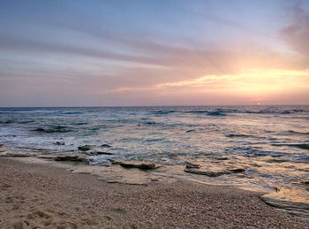 Scenic view of sea at sunset