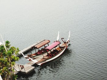 High angle view of people sailing boat in lake