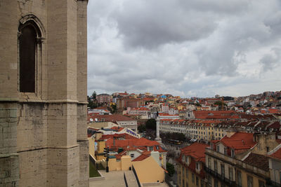 View of town against cloudy sky