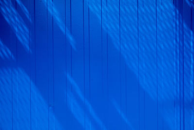 Sunlight falling on blue wall