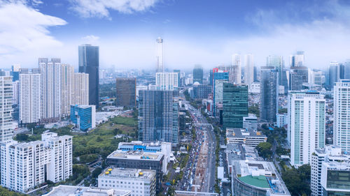 High angle view of buildings in city against sky