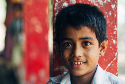 Close-up portrait of smiling boy