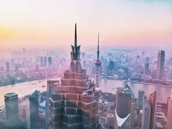 Aerial view of city buildings during sunset