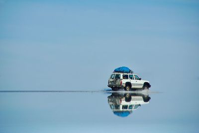 Ship in sea against clear sky