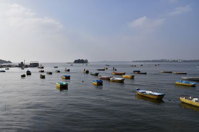 Small multi-color boats sailing in the lake, bhopal