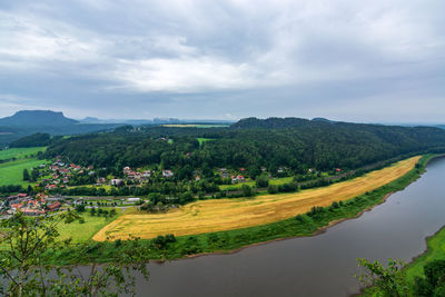 Scenic view of agricultural field against sky