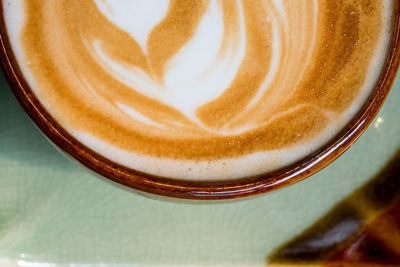 Close-up of cappuccino on table