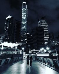 View of skyscrapers in city at night