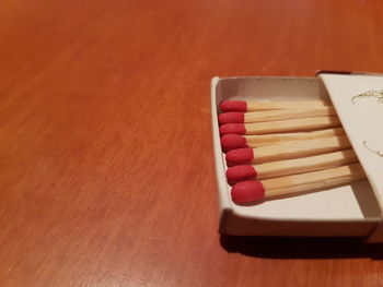 Close-up of matchsticks on table