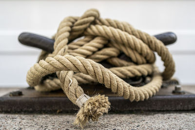 Close-up of rope tied on wood