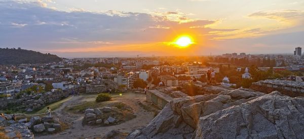 Aerial view of townscape against sky during sunset