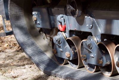 Cropped image of bulldozer on field