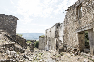 Old ruin building against sky