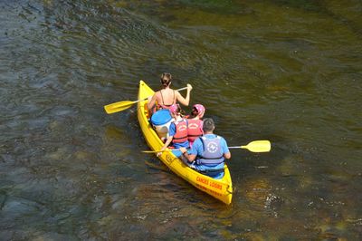 High angle view of people sitting in boat