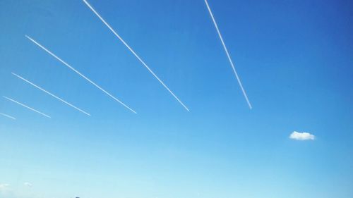 Low angle view of vapor trails in sky