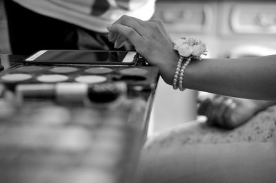 Midsection of woman playing piano