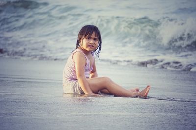 Portrait of woman sitting on beach