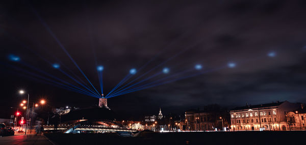 Illuminated buildings in city at night