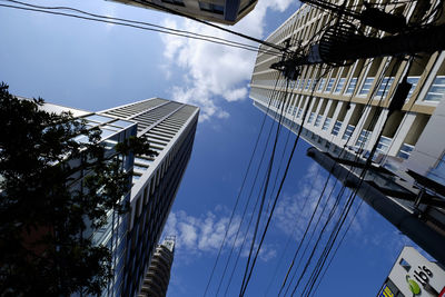 Low angle view of skyscraper against sky