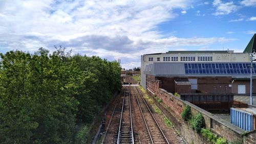 Train on railroad tracks against sky