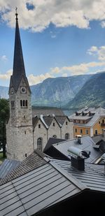 High angle view of buildings against cloudy sky