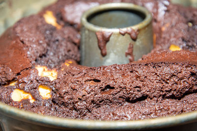 Close-up of chocolate cake on rusty metal