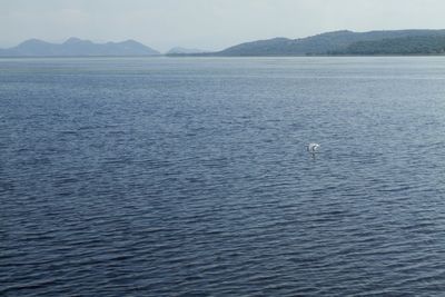 Scenic view of sea against mountain