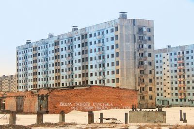 Low angle view of buildings against clear sky