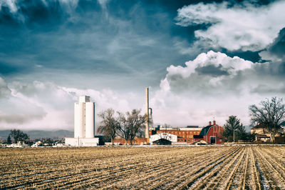 Panoramic shot of agricultural field against sky