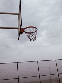 Low angle view of basketball hoop against sky