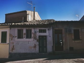 Low angle view of building against blue sky