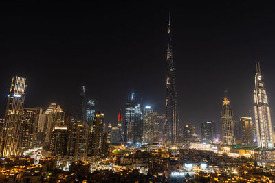 Illuminated buildings in city at night