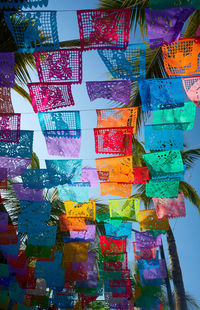 Low angle view of multi colored hanging for sale in market