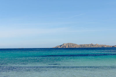 Scenic view of sea against blue sky