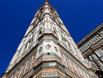 Low angle view of ornate building against sky