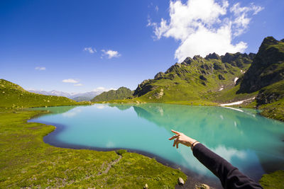 Wide angle lens landscape and mountain reflections in okhrotskhali in svaneti, georgia.