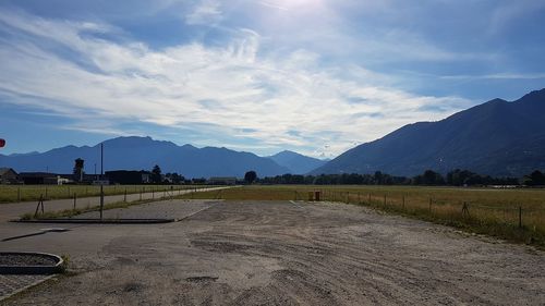 Scenic view of landscape and mountains against sky