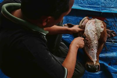 Butcher cutting beef