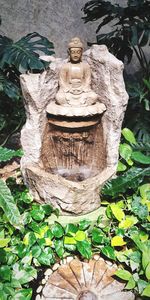 Close-up of statue against trees