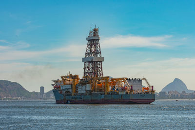 Ship in sea against sky