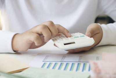 Close-up of man working on table