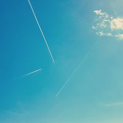 Low angle view of vapor trails in sky