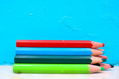 Close-up of multi colored pencils on table