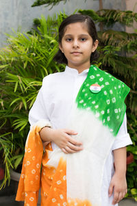 Portrait of a girl standing outdoors