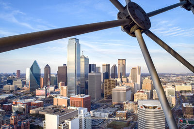 Modern buildings in city against sky