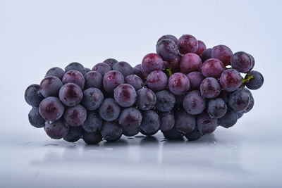 Close-up of grapes against white background