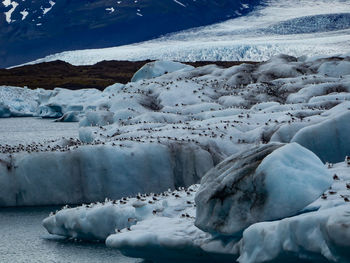 Scenic view of snow covered mountains