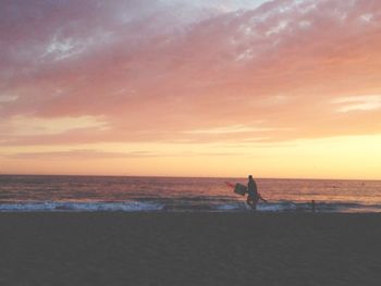 Scenic view of sea at sunset