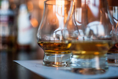 Close-up of scotch whiskey glasses on table